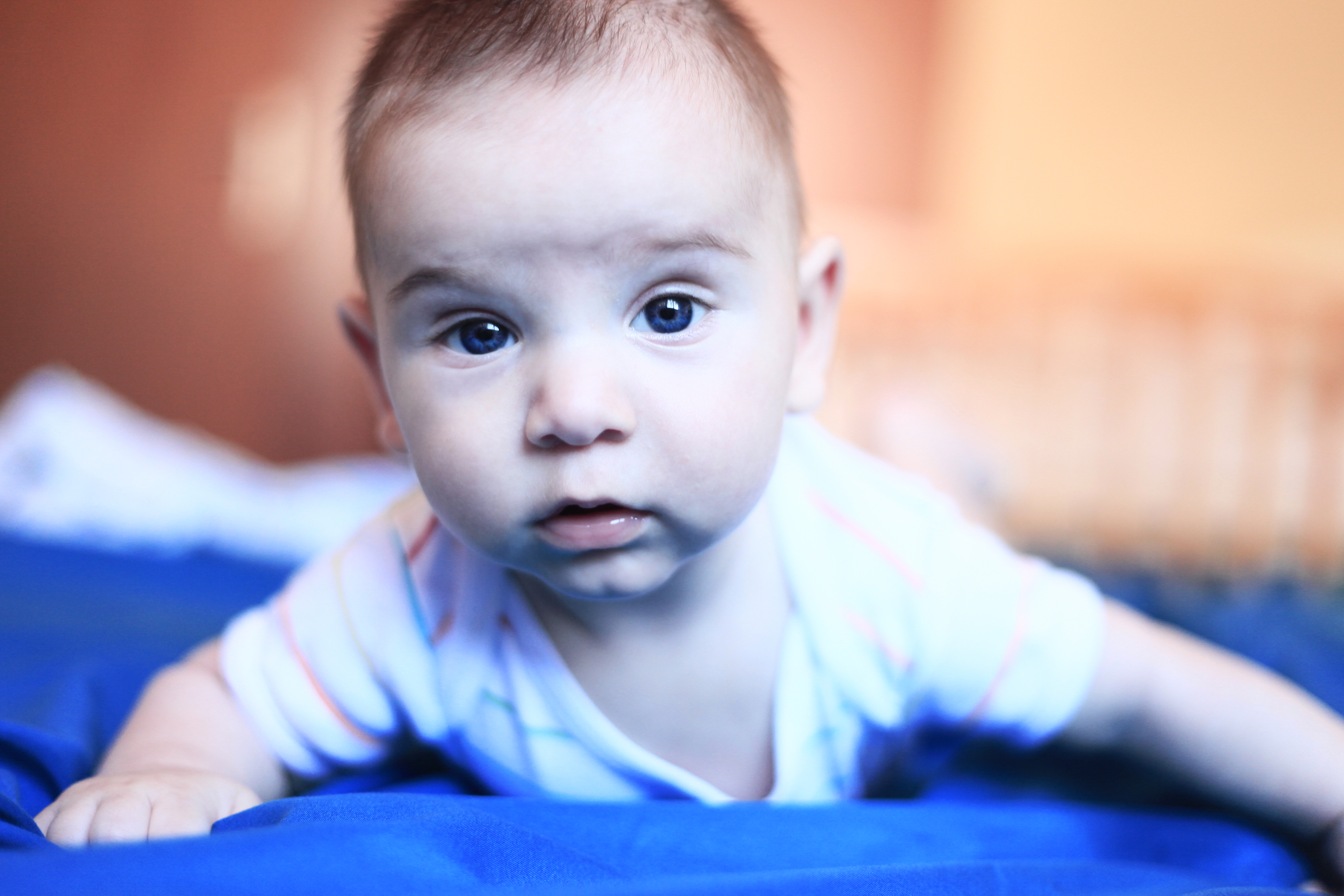 Newborn boy in blue wrap